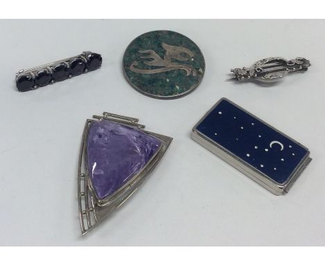 A stylish amethyst and silver brooch etc. Approx. 54 grams. Est. £20 - £30.