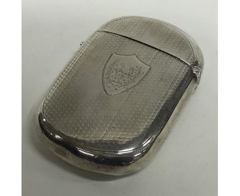 A massive silver cushion shaped card case with engine turned decoration and crested armorial. Birmingham. By H&amp;T. Approx.