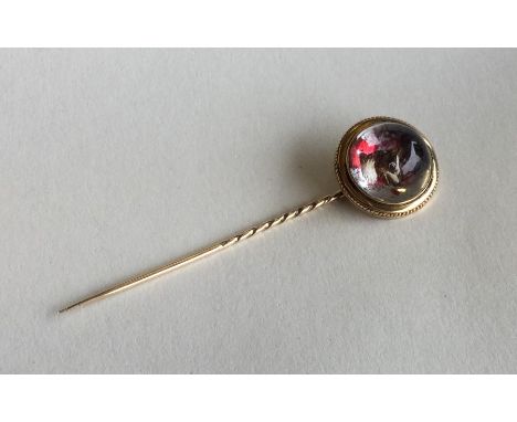 ESSEX CRYSTAL: An unusual stick pin mounted with a dog's head. Approx. 7.9 grams. Est. £100 - £150.