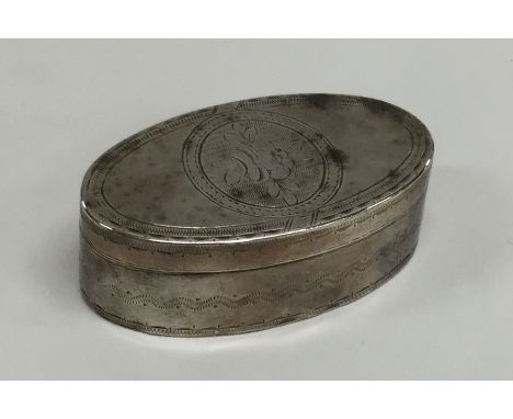 An 18th Century engraved oval silver snuff box. Punched to lid and base. Approx. 49 grams. Est. £50 - £80.