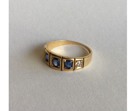 A sapphire and diamond five stone gypsy set ring in 18 carat. Approx. 3 grams. Est. £50 - £80.