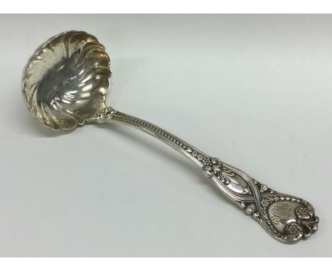 TIFFANY &amp; CO: An unusual silver sauce ladle decorated with flowers and leaves. Approx. 92 grams. Est. £50 - £80.