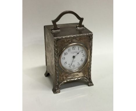 A good Edwardian silver mantle clock on bracket feet with white enamelled dial. By William Cummins. Approx. 7.5 cms high. App
