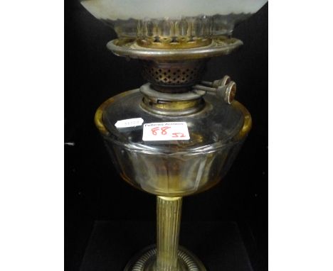 Early 20th Century Glass and Brass Oil Lamp in Collum form. Overall Height Includung Chimney 74cm 