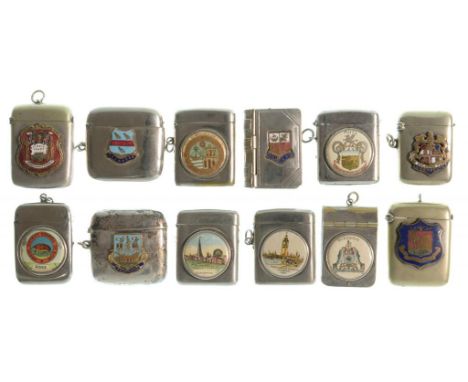 TWELVE PLATED VESTA CASES WITH APPLIED ENAMEL BOROUGH ARMS OR PRINTED CELLULOID SCENES, C1900 , comprising Franco British Exh