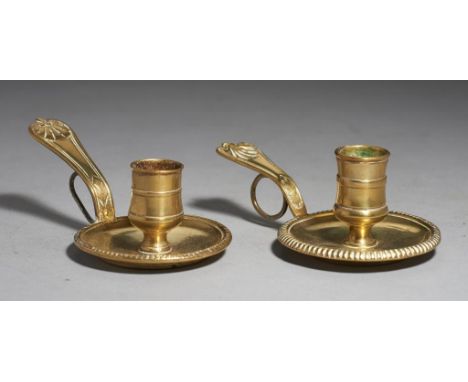 A PAIR OF LOUIS XV BRASS CANDLESTICKS, MID 18TH C  with brass wire ring under the handle, 14cm l++Light wear, minor dents and
