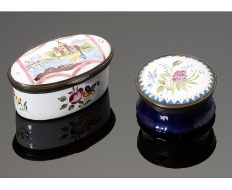 TWO CONTINENTAL ROUND AND OVAL ENAMEL BOXES, EARLY 20TH C  painted with a river scene or flowers, brass mount, 4cm diam or 6c