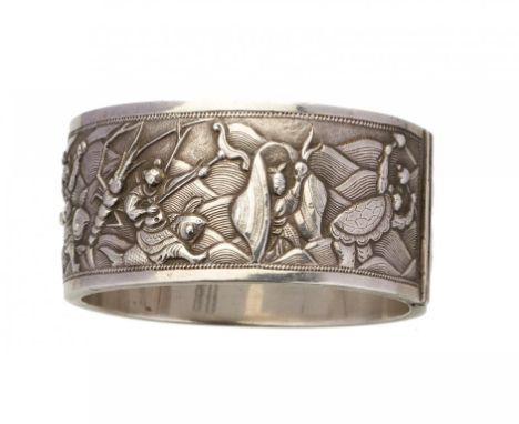 A CHINESE EXPORT SILVER REPOUSSE BANGLE, C1900 decorated to either side with groups of figures, 57 x 64mm, marked WANG HING..