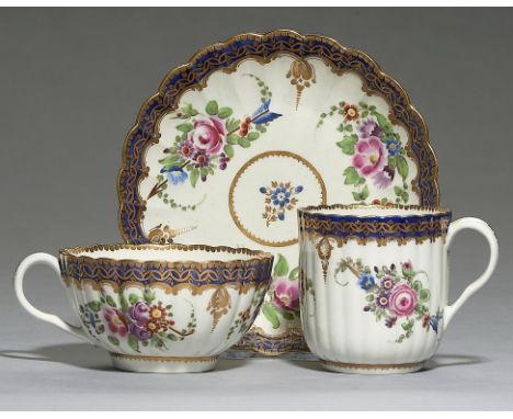 A WORCESTER FLUTED TRIO, C1785 painted with the Marriage pattern of Cupid's bow and arrow disguised in groups of flowers, sau