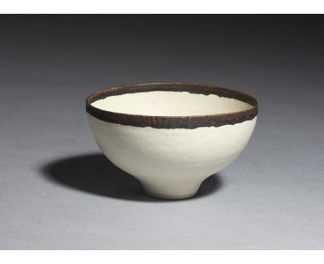 DAME LUCIE RIE, DBE (1902-1995) PORCELAIN BOWL, C1960-65  ovoid on foot in white glaze with manganese rim, 10cm w, impressed 