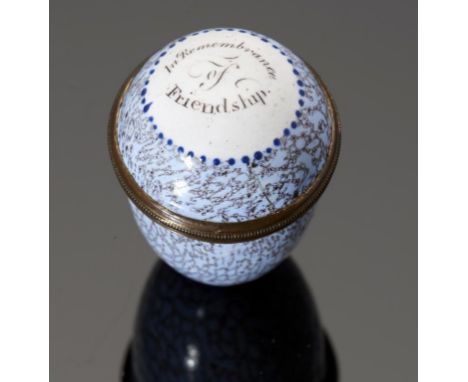 A SOUTH STAFFORDSHIRE ENAMEL BIRD'S EGG SHAPED NUTMEG GRATER AND COVER, C1770 realistically 'marbled' on a light blue ground,