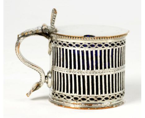 A PIERCED AND ENGRAVED SHEFFIELD PLATE CYLINDRICAL MUSTARD POT, C1775 blue glass liner, 6.5cm h++Light wear but undamaged, pl