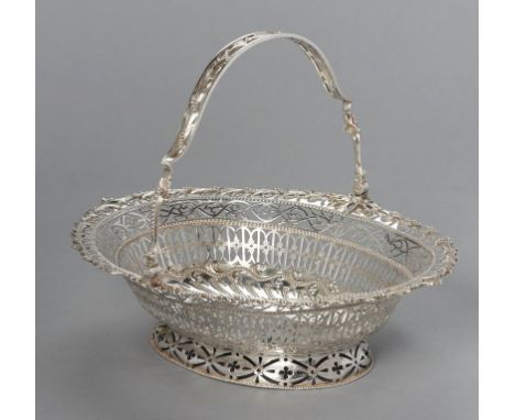 A FINE GEORGE III SILVER CAKE OR BREAD BASKET chased and finely pierced with stylised foliage in berried leafy border, swing 