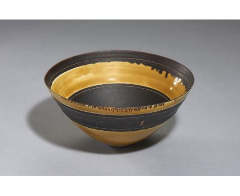 DAME LUCIE RIE, DBE (1902-1995) PORCELAIN BOWL, C1960  in manganese with incised lines between the yellow   oxide glaze, 22cm