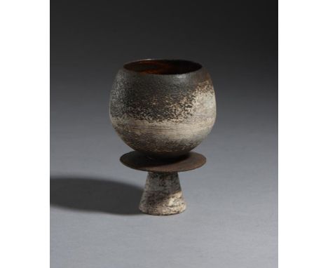 HANS COPER (1920-1981) STONEWARE STEM CUP FORM WITH CENTRAL DISC, 1965 with bulbous bowl and thin disc with manganese brushed