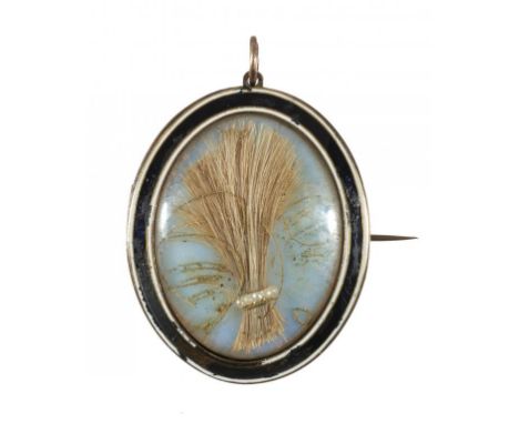 AN 18 CT GOLD AND ENAMEL MOURNING LOCKET, DATED 1797  inset with hair over foiled glass in blue and white enamel border, the 