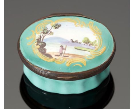 A SOUTH STAFFORDSHIRE ENAMEL PATCH BOX the lid painted with a figure in a landscape reserved on a green ground, 4.3cm++Some p