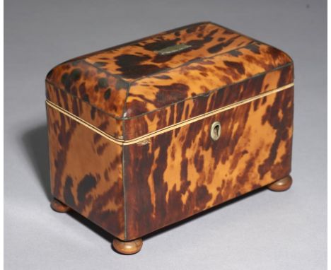 A REGENCY TORTOISESHELL TEA CADDY, C1820 with wire stringing, divided interior with the original covers, and vegetable ivory 