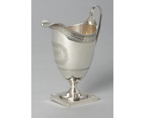 A GEORGE III BRIGHT CUT SILVER CREAM JUG of helmet shape,on square foot, 14cm h, by Henry Chawner, London 1789, 4ozs 10dwts++