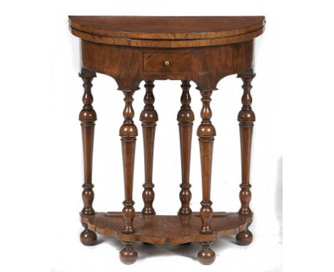 A WILLIAM III WALNUT AND FEATHERBANDED GATE LEG CARD TABLE, C1700 the crossbanded top in matched veneers, the ogee apron fitt