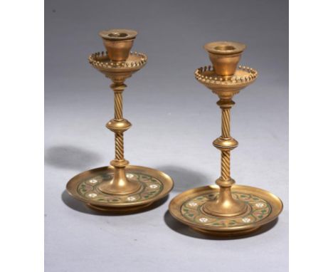 A PAIR OF VICTORIAN GILT BRASS AND CHAMPLEVE ENAMEL DESK CANDLESTICKS, C1870 with a design of trailing roses in purple, white