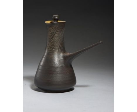 DAME LUCIE RIE, DBE (1902-1995) STONEWARE WATER POT AND  COVER, C1950-59 in manganese with diagonal sgraffito lines to the ne