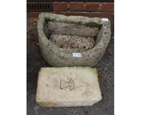 A D SHAPED GARDEN PLANTER together with a garden brick 