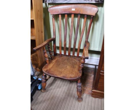 A 19TH CENTURY STICK BACK COUNTRY KITCHEN ARMCHAIR with solid seat 