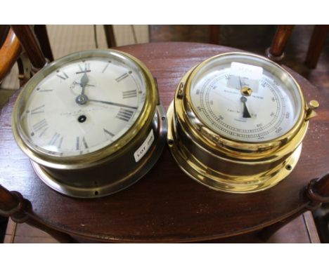 TWO BRASS SHIPS PORTHOLE STYLE DECORATIVE ITEMS one a clock the other a barometer 