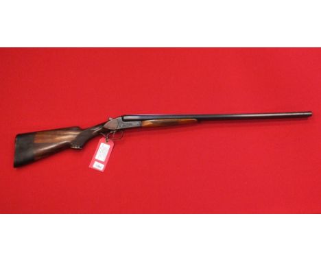 A Baikal 12 bore 'Deluxe' S/S B.L.E. shotgun in overall good condition with fire bores, S/No.C27055, this item can only be pu