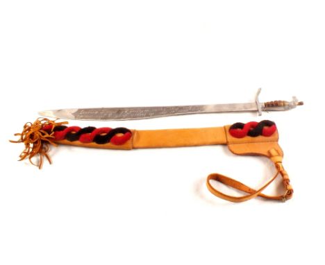 A decorative sword with birds head pommel within its leather scabbard