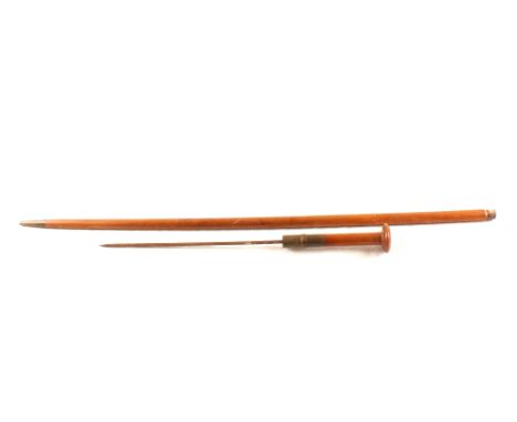 A vintage hardwood cane with brass collar, cane concealing a diamond shaped 11 1/2" blade and brass collar with later inscrip