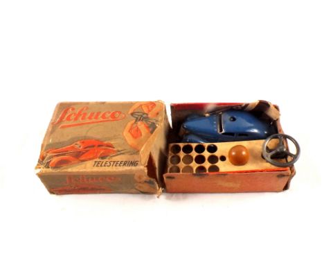 A boxed Schuco telesteering car No.3000 with leaflet (distressed box)