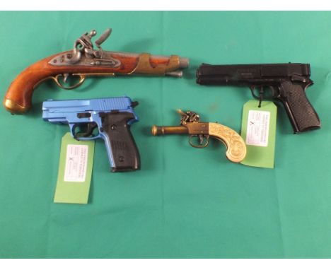 A mixed lot including a Sig soft air B.B. pistol, a Gio air pistol B.B. repeater and two decorative die cast pistols, as a po