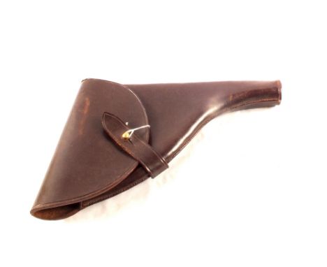 A military leather holster for a .38 revolver with a leather covered swagger stick