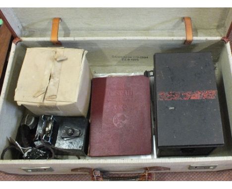A vintage case containing A.R.P. related items including a first aid tin with contents