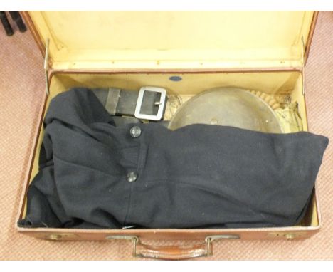 A vintage case containing N.F.S. items including a jacket (dated 1943), two belts, gas mask (dated 1938) and a helmet marked 