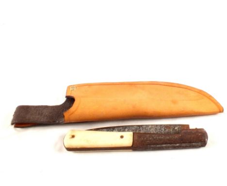 A vintage folding knife in a later leather sheath