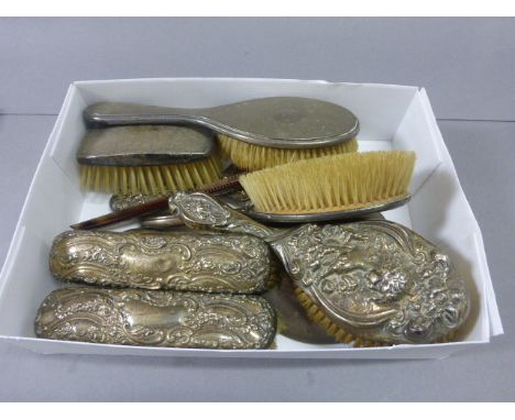 Collection of Matched Silver Backed Dressing Table Items including Two Mirrors, Six Brushes and a Comb