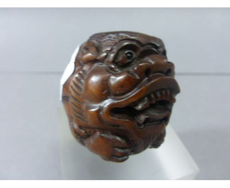 Signed Wood Netsuke of a Dog of Foo