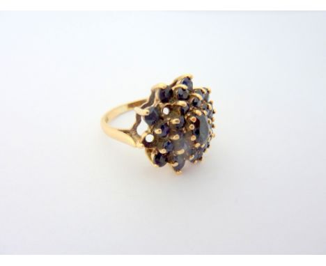 A 9CT GOLD SAPPHIRE CLUSTER RING, two stone deficient, hallmarks for London 1978 ring size O