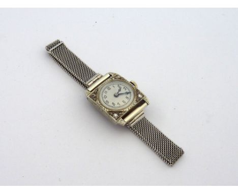 A LADIES DIAMOND WATCH, circa 1910, the circular dial within a square-shape with old-cut diamonds, fifteen jewelled movement,