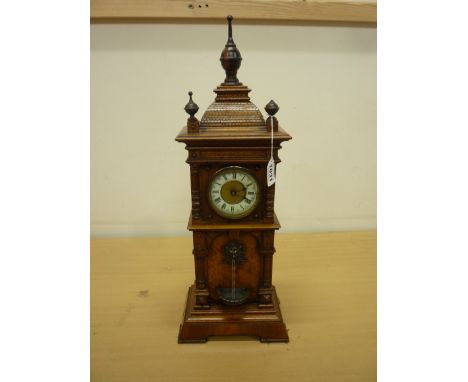 A LATE 19TH CENTURY GERMAN WALNUT WATERFALL MANTEL TIMEPIECE, the 8cm dial with cream enamel chapter ring having black Roman 