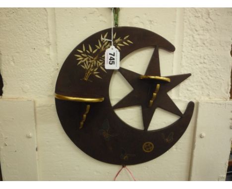 A JAPANESE LACQUER NOVELTY CURIO SHELF, Taisho period, formed as a crescent moon cradling a six pointed star supporting two s