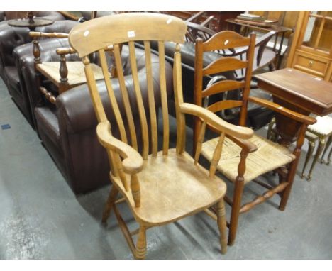 A SLAT BACK KITCHEN ARMCHAIR, and a rush seated ladder back armchair (2) (s.d.)