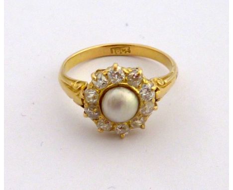 AN 18CT GOLD PEARL AND DIAMOND RING, the central pearl within a surround of old cut diamonds, stamped 18ct, ring size L