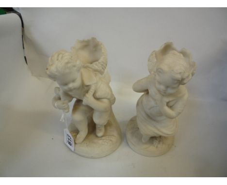 A PAIR OF CONTINENTAL BISQUE SPILL VASES, shaped as children carrying sheaves of wheat
