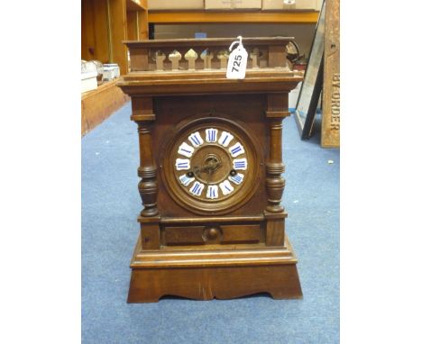 AN EDWARDIAN GERMAN WALNUT/OAK BRACKET TYPE CLOCK, Roman numerals, eight day spring driven movement striking the hour and hal