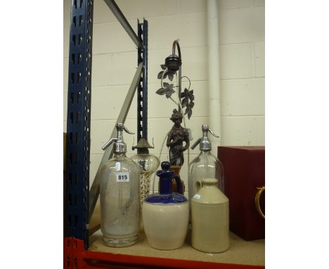 TWO SODA SYPHONS, STONEWARE BOTTLES, TABLE LAMP, etc