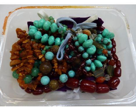 A SMALL TRAY, of assorted vintage beaded necklaces